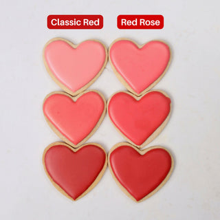 Classic Red and Red Rose gel food coloring compared on heart cookies, three tones each